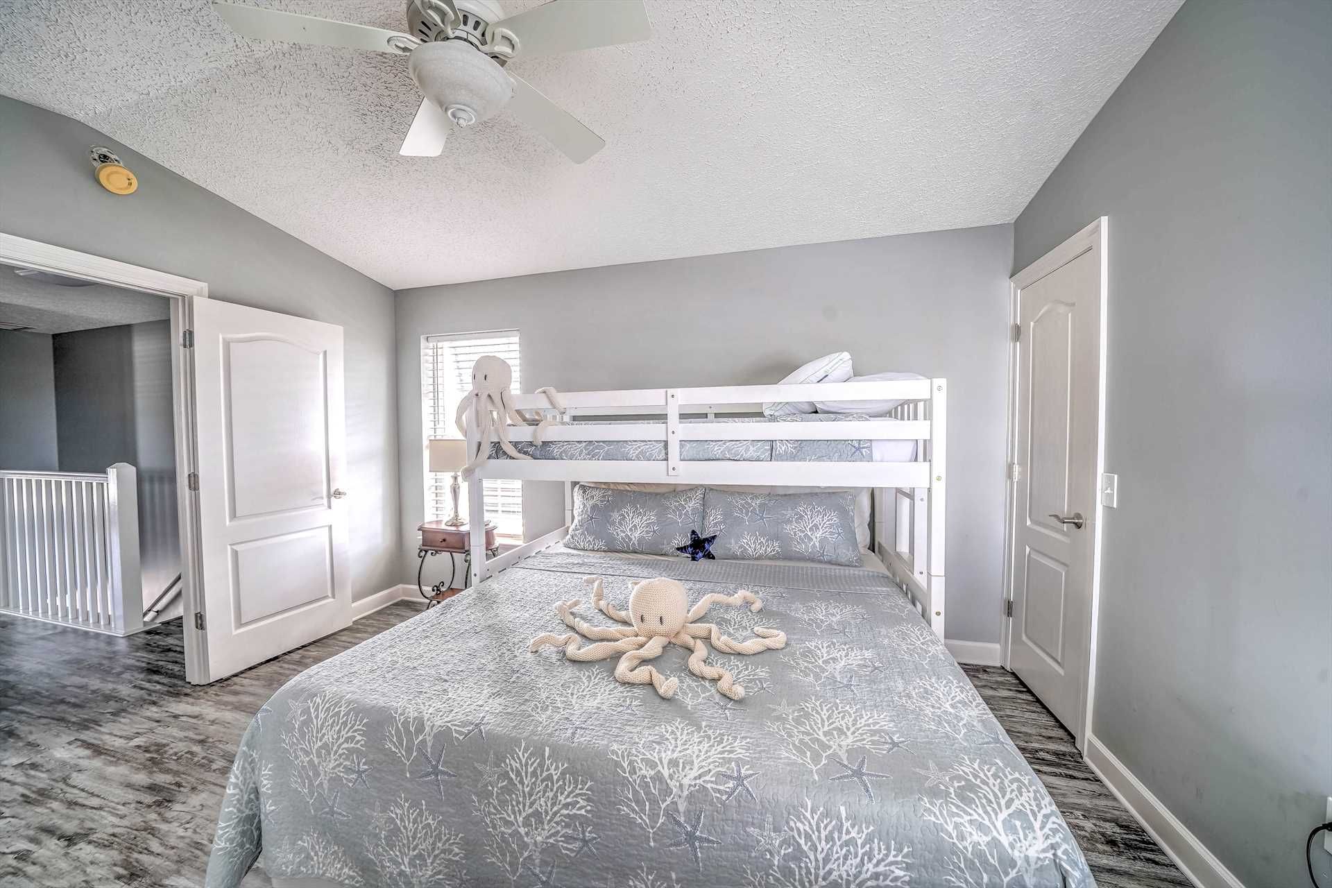 Guest bedroom with king bed and twin bunk above