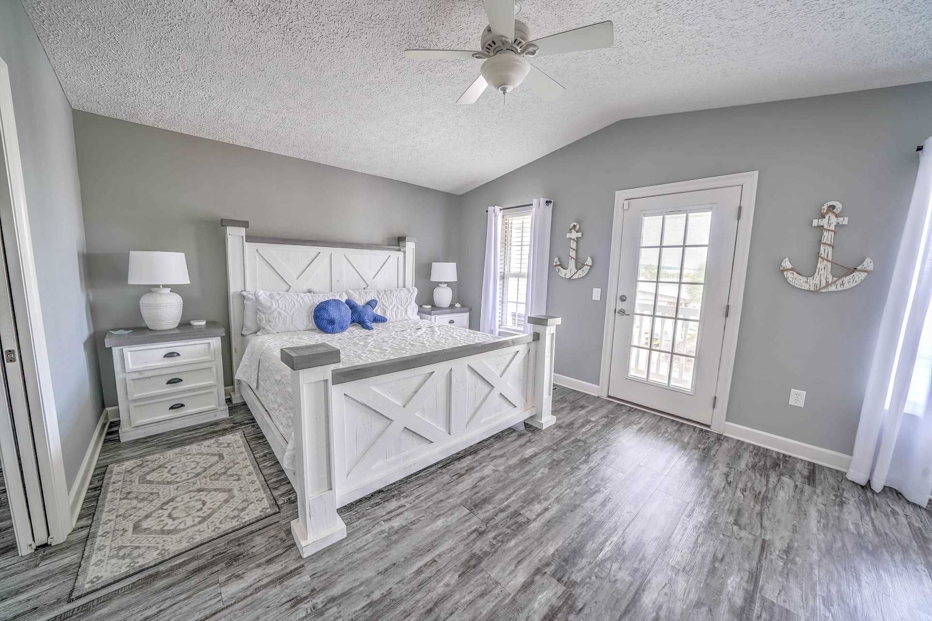 Master King bedroom with white furniture and coastal accents