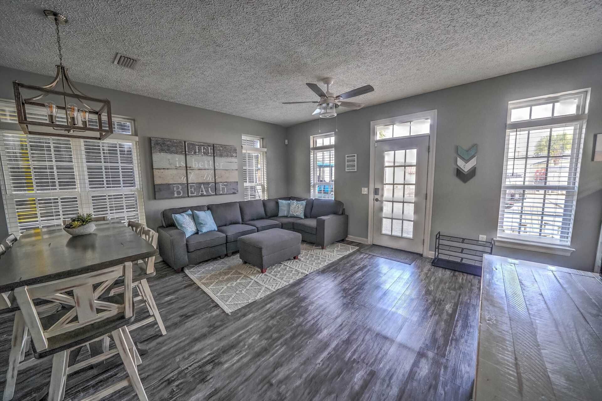 Wide view from living area into dining and kitchen